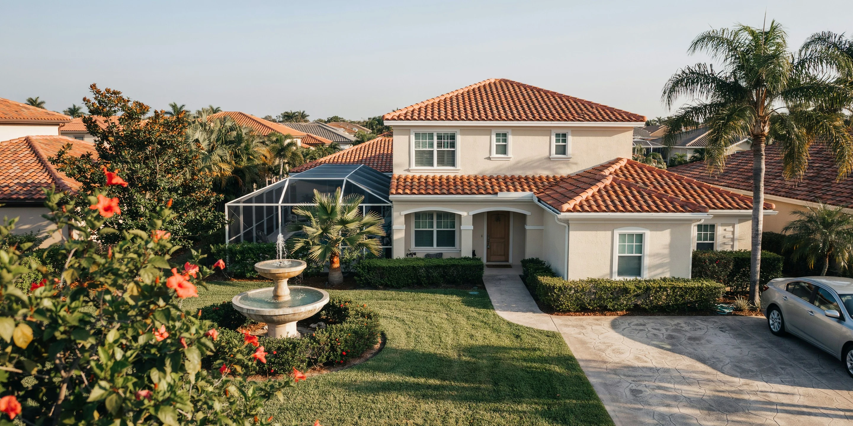 Tile-roof home with pool cage near downtown Sarasota, FL