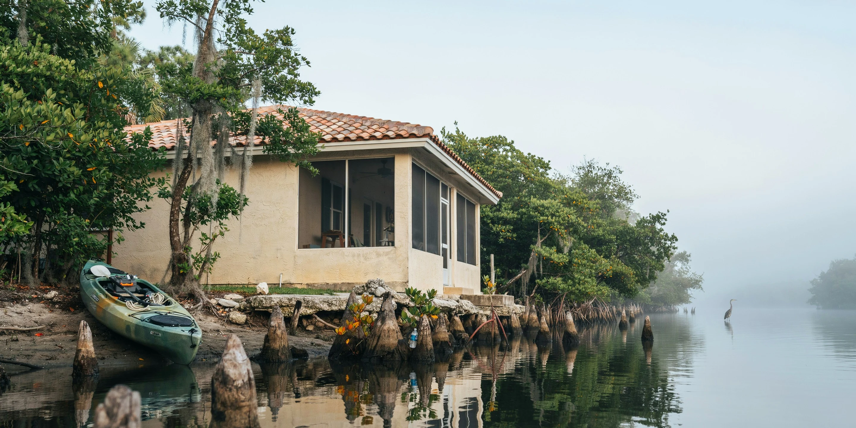 Bayou-front home with screened porch in South Sarasota, FL